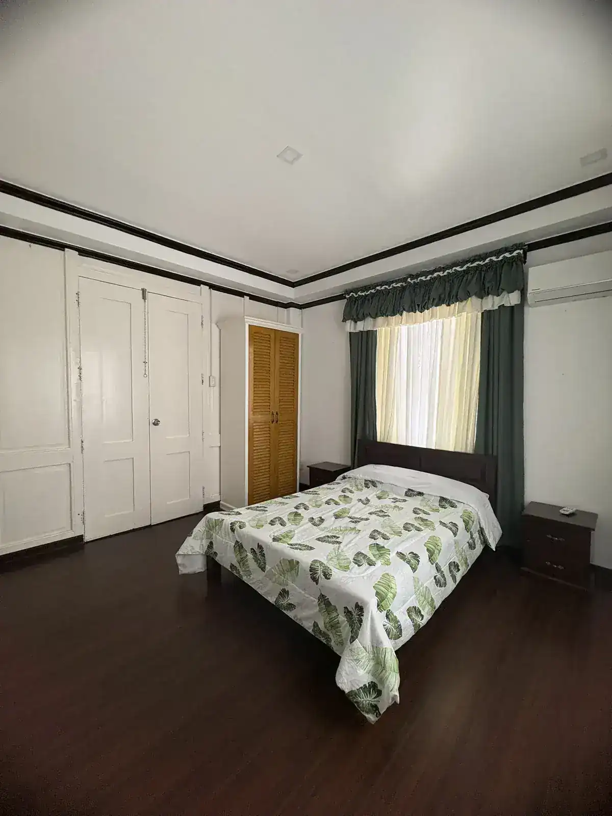 Air-conditioned bedroom with queen bed